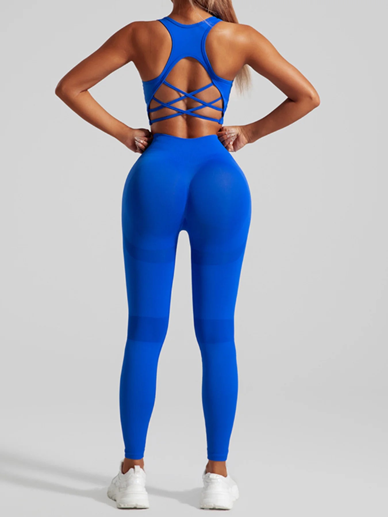 Ensemble de sport sans coutures pour femme : pantalon de yoga taille haute et brassière de sport avec coussinets amovibles pour un effet push-up fessier, idéal pour la course et l'entraînement.