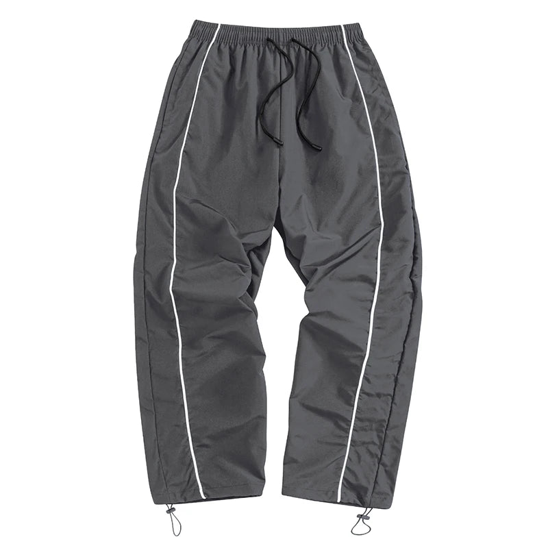 Pantalon de sport tendance pour homme, avec lignes, idéal pour la salle de sport et la course à pied. Poches latérales, séchage rapide et respirant.
