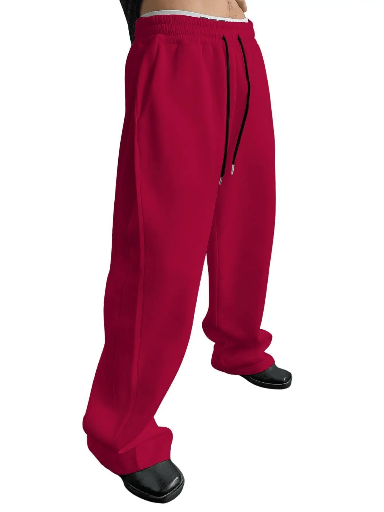 Pantalon de jogging pour homme, coupe droite, idéal pour le sport et la mode urbaine. Pantalon ample et décontracté avec cordon de serrage et plusieurs poches.