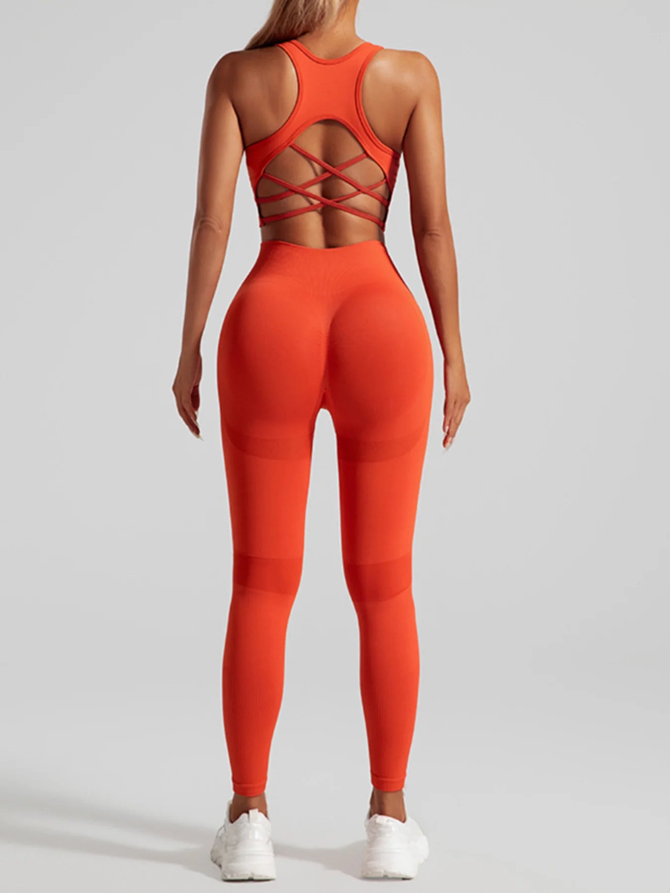 Ensemble de sport sans coutures pour femme : pantalon de yoga taille haute et brassière de sport avec coussinets amovibles pour un effet push-up fessier, idéal pour la course et l'entraînement.