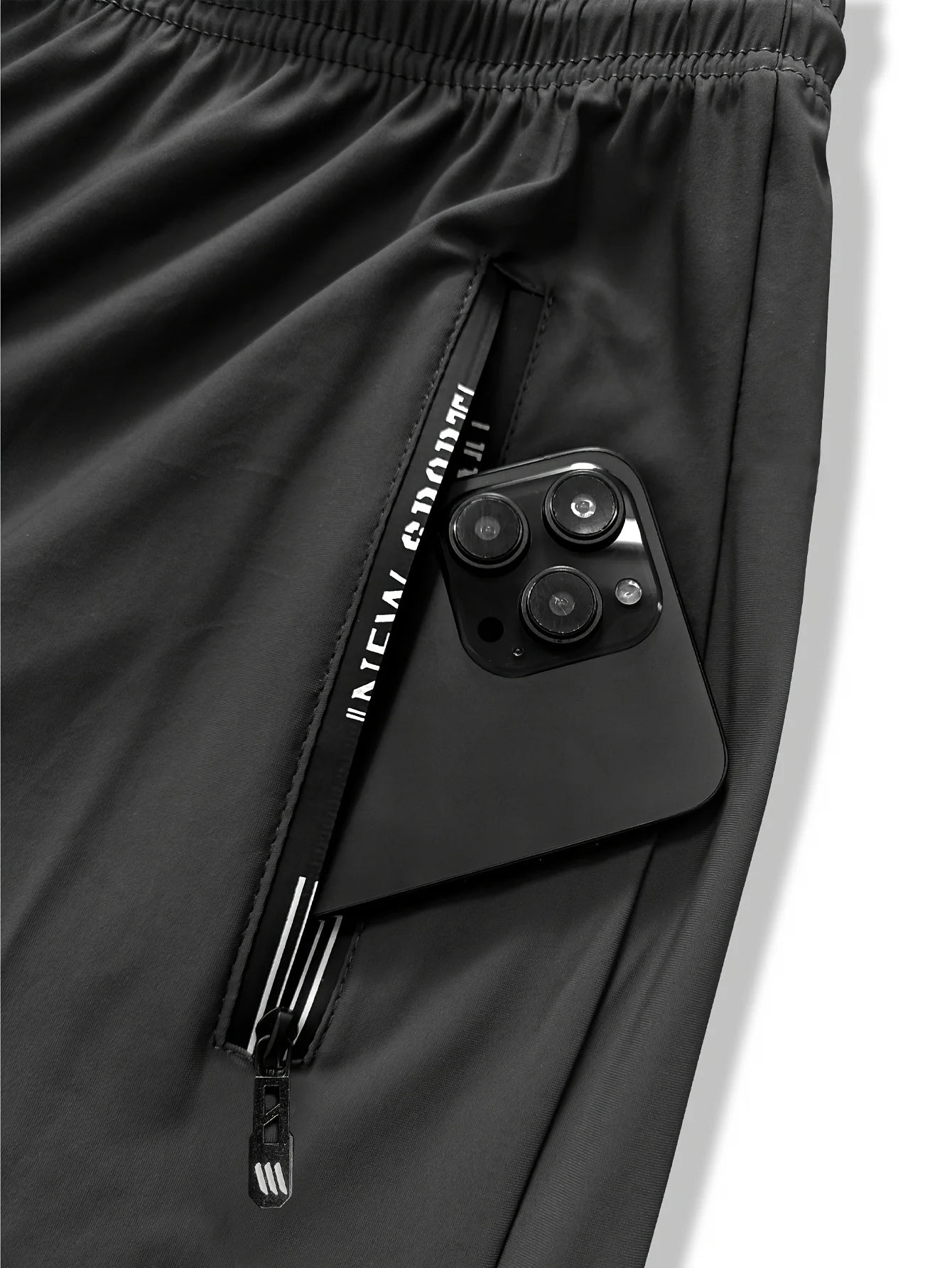 Pantalon de jogging homme, idéal pour la pêche. Modèle en soie glacée extensible avec poches zippées. Pantalon de sport respirant et élastique. Idée cadeau pour homme.