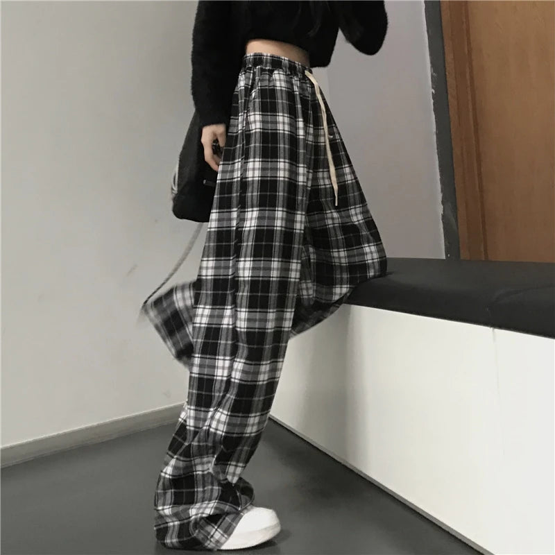 Pantalon de survêtement oversize pour femme, style tendance, à carreaux noirs, coupe ample, taille élastique, poches, style hip-hop unisexe, coupe ample.