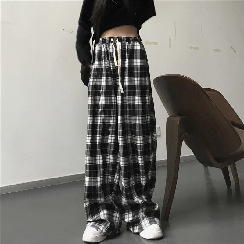 Pantalon de survêtement oversize pour femme, style tendance, à carreaux noirs, coupe ample, taille élastique, poches, style hip-hop unisexe, coupe ample.