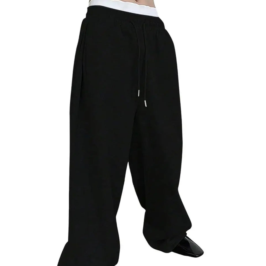 Pantalon de jogging pour homme, coupe droite, idéal pour le sport et la mode urbaine. Pantalon ample et décontracté avec cordon de serrage et plusieurs poches.
