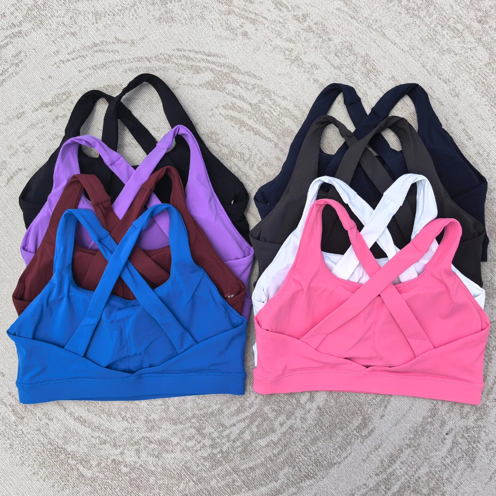 Soutien-gorge de sport et de fitness femme, couleur unie, moulant, dos croisé, idéal pour le yoga et la gym. Haut de sport avec dos ajouré et coussinets push-up.