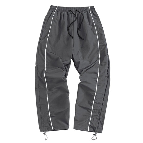 Pantalon de sport tendance pour homme, avec lignes, idéal pour la salle de sport et la course à pied. Poches latérales, séchage rapide et respirant.