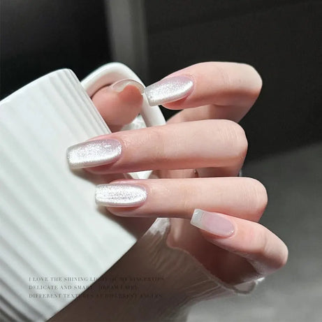 Vernis à ongles gel holographique à paillettes effet miroir blanc porcelaine, effet œil de chat, 10 ml, effet galactique magnétique, à dissoudre sous une lampe UV LED.