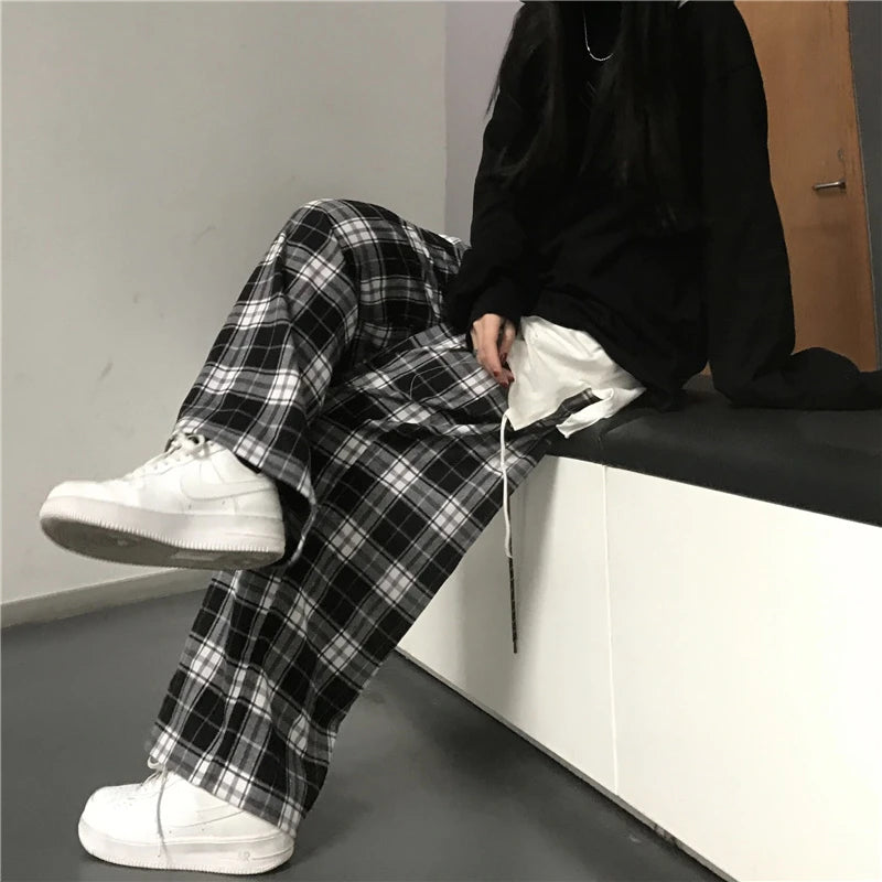 Pantalon de survêtement oversize pour femme, style tendance, à carreaux noirs, coupe ample, taille élastique, poches, style hip-hop unisexe, coupe ample.