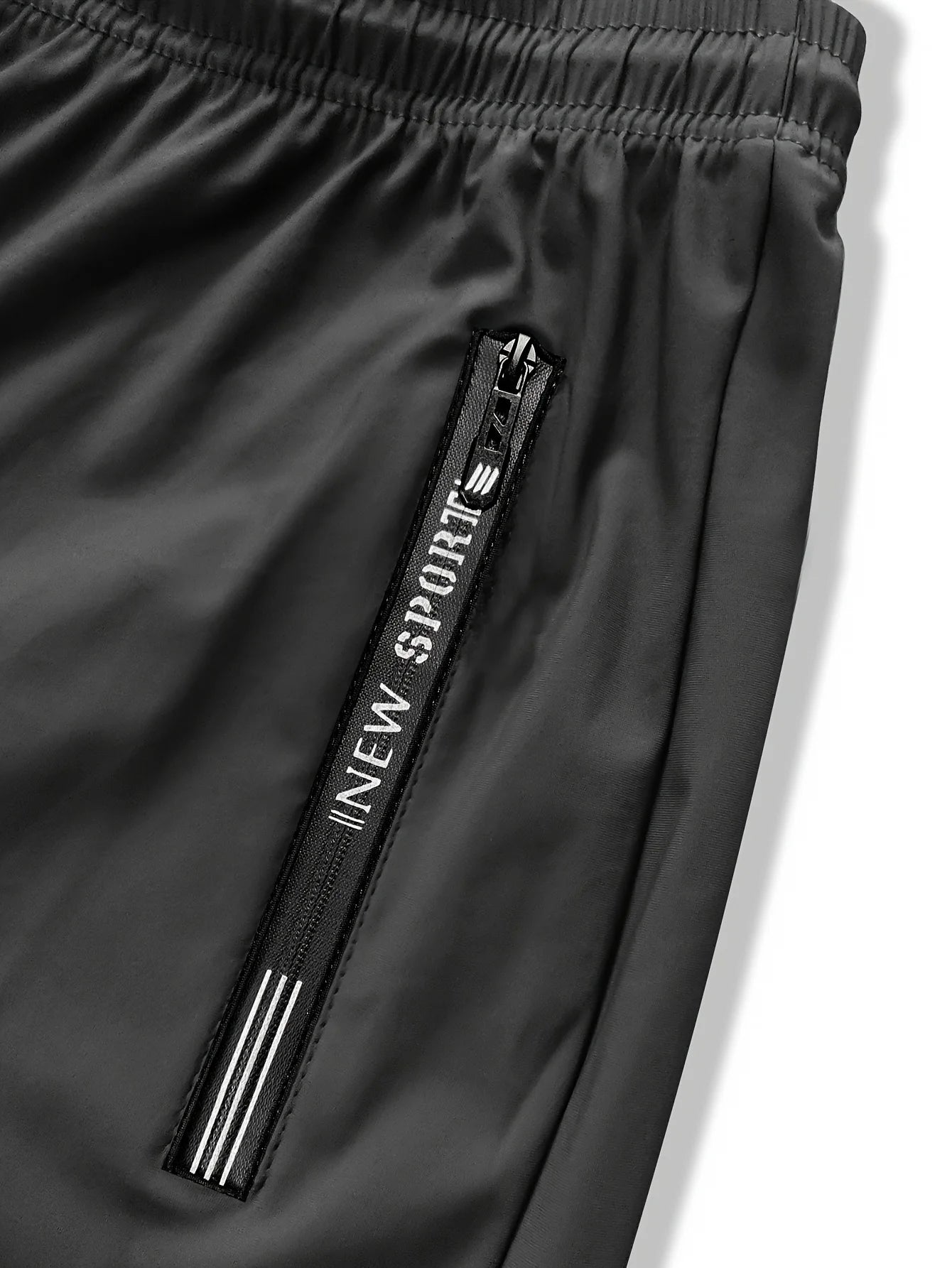 Pantalon de jogging homme, idéal pour la pêche. Modèle en soie glacée extensible avec poches zippées. Pantalon de sport respirant et élastique. Idée cadeau pour homme.