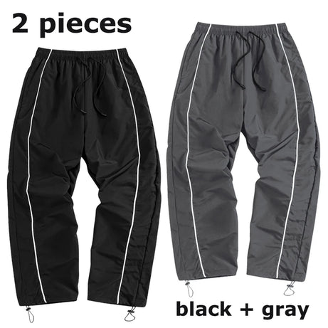Pantalon de sport tendance pour homme, avec lignes, idéal pour la salle de sport et la course à pied. Poches latérales, séchage rapide et respirant.
