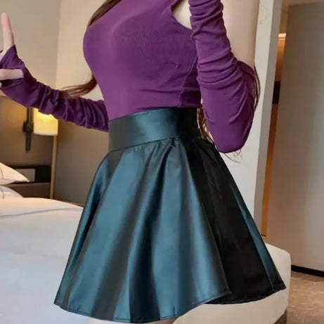 Jupe courte élastique polyvalente pour femme, en similicuir, taille haute, idéale pour le patinage, le travail et les soirées. Parfaite pour le travail et les sorties en boîte de nuit.