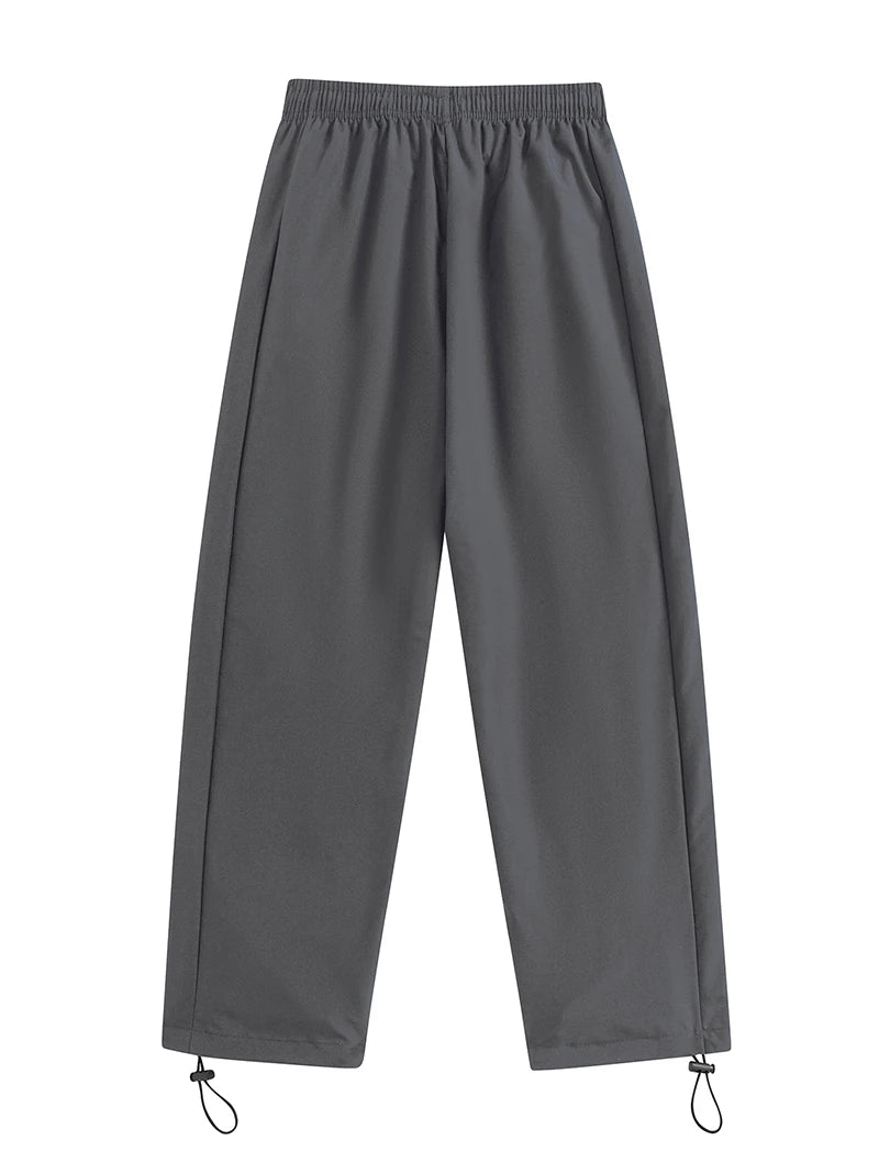 Pantalon de sport tendance pour homme, avec lignes, idéal pour la salle de sport et la course à pied. Poches latérales, séchage rapide et respirant.