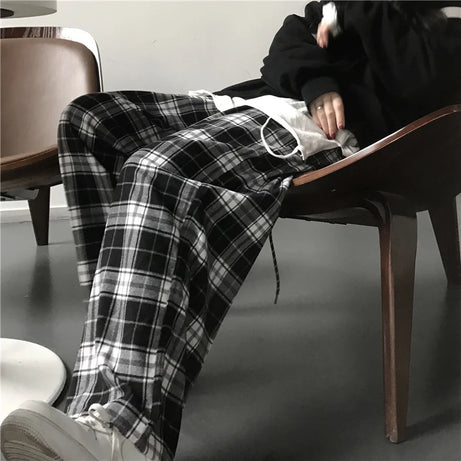 Pantalon de survêtement oversize pour femme, style tendance, à carreaux noirs, coupe ample, taille élastique, poches, style hip-hop unisexe, coupe ample.