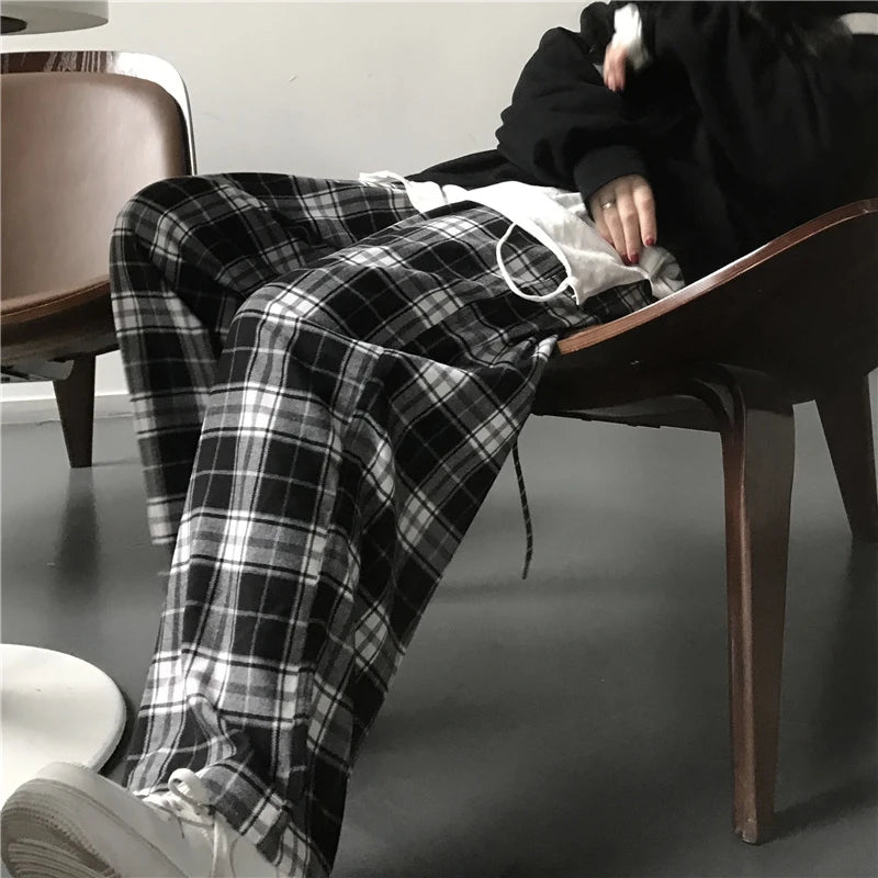 Pantalon de survêtement oversize pour femme, style tendance, à carreaux noirs, coupe ample, taille élastique, poches, style hip-hop unisexe, coupe ample.