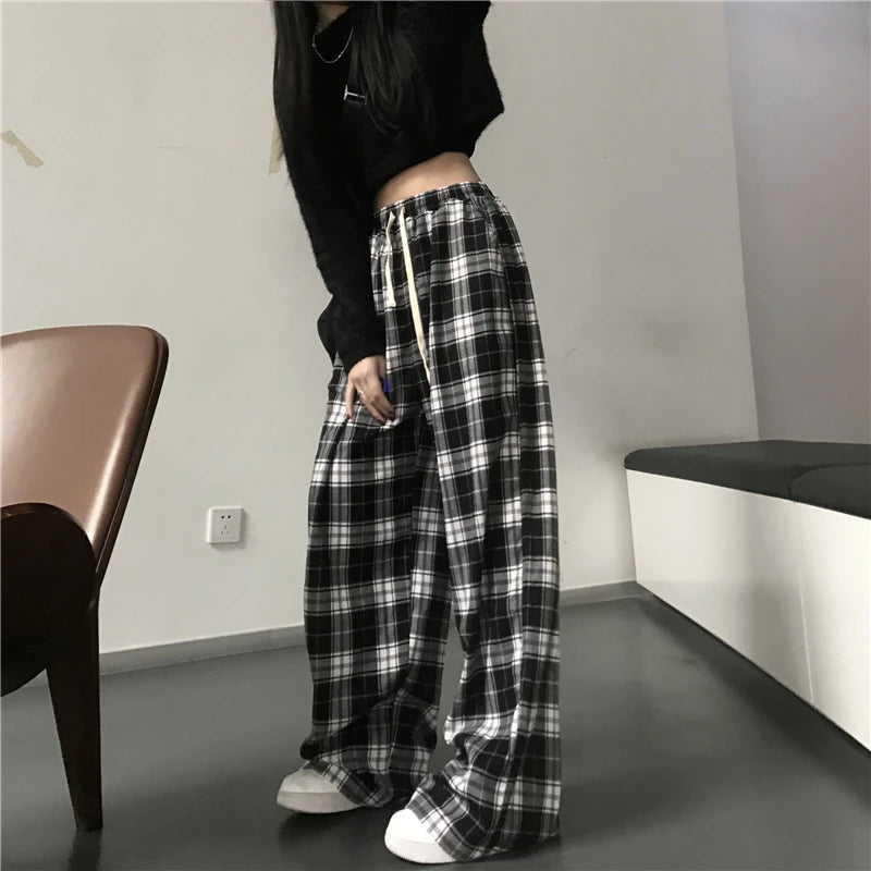 Pantalon de survêtement oversize pour femme, style tendance, à carreaux noirs, coupe ample, taille élastique, poches, style hip-hop unisexe, coupe ample.