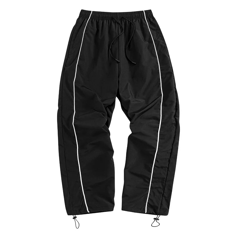 Pantalon de sport tendance pour homme, avec lignes, idéal pour la salle de sport et la course à pied. Poches latérales, séchage rapide et respirant.