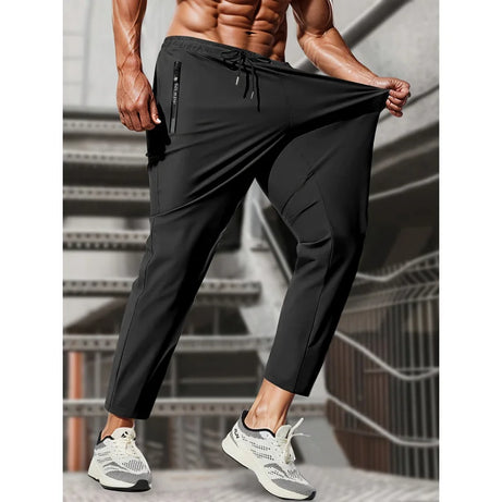 Pantalon de jogging homme, idéal pour la pêche. Modèle en soie glacée extensible avec poches zippées. Pantalon de sport respirant et élastique. Idée cadeau pour homme.