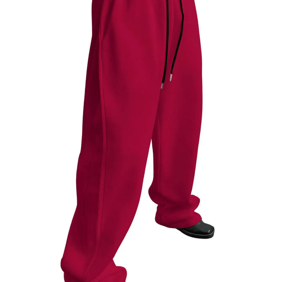 Pantalon de jogging pour homme, coupe droite, idéal pour le sport et la mode urbaine. Pantalon ample et décontracté avec cordon de serrage et plusieurs poches.