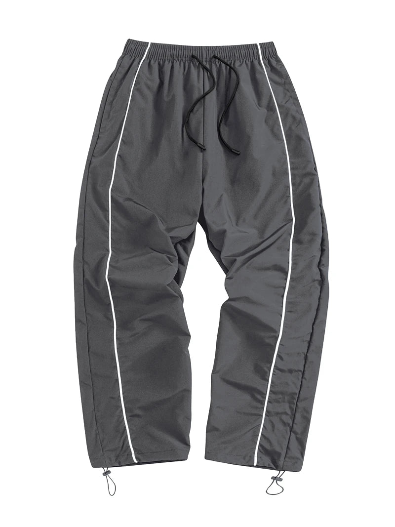 Pantalon de sport tendance pour homme, avec lignes, idéal pour la salle de sport et la course à pied. Poches latérales, séchage rapide et respirant.