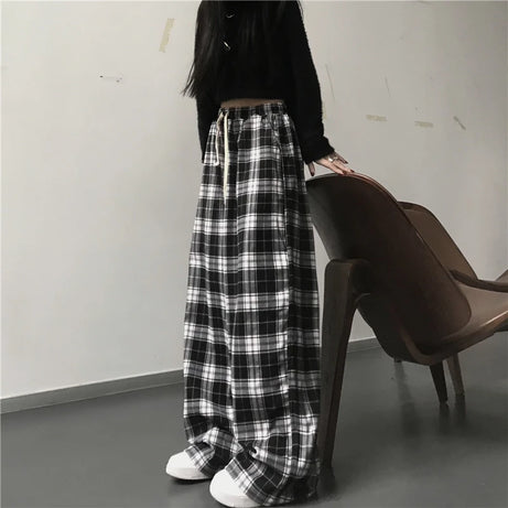 Pantalon de survêtement oversize pour femme, style tendance, à carreaux noirs, coupe ample, taille élastique, poches, style hip-hop unisexe, coupe ample.