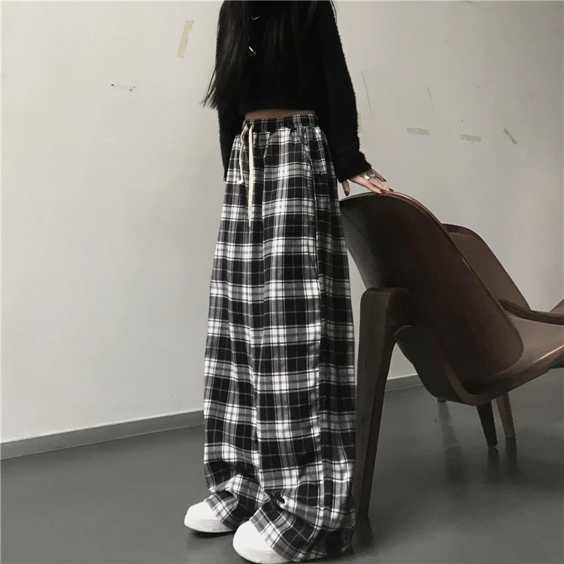 Pantalon de survêtement oversize pour femme, style tendance, à carreaux noirs, coupe ample, taille élastique, poches, style hip-hop unisexe, coupe ample.