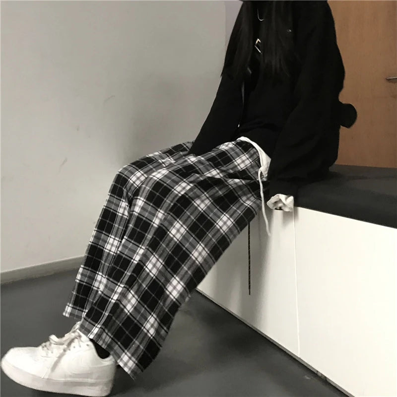 Pantalon de survêtement oversize pour femme, style tendance, à carreaux noirs, coupe ample, taille élastique, poches, style hip-hop unisexe, coupe ample.