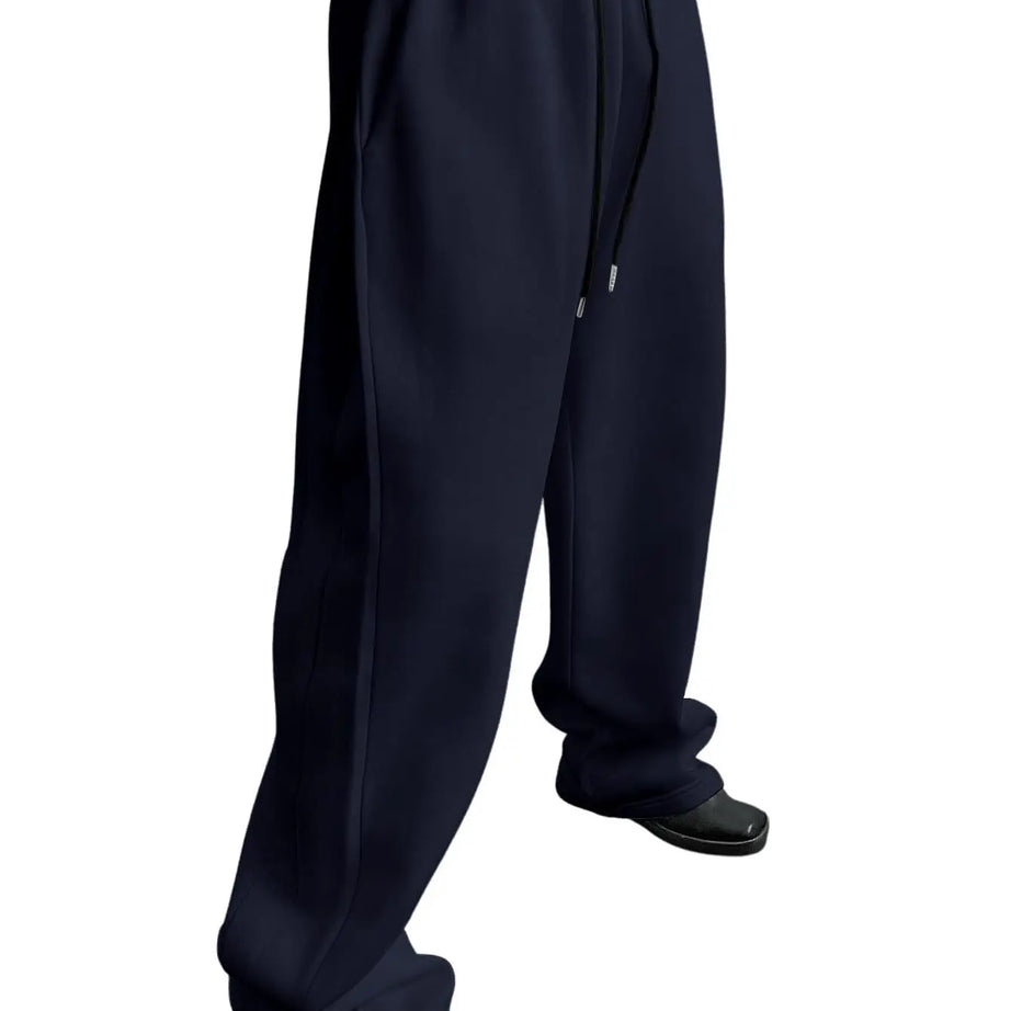 Pantalon de jogging pour homme, coupe droite, idéal pour le sport et la mode urbaine. Pantalon ample et décontracté avec cordon de serrage et plusieurs poches.
