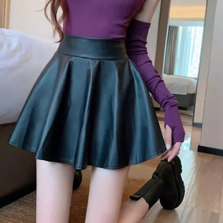 Jupe courte élastique polyvalente pour femme, en similicuir, taille haute, idéale pour le patinage, le travail et les soirées. Parfaite pour le travail et les sorties en boîte de nuit.