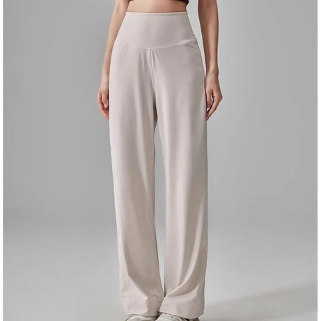 Pantalon de sport pour femme de haute qualité avec poches, taille haute, extensible et ample, effet seconde peau, idéal pour le sport, les loisirs et le yoga.