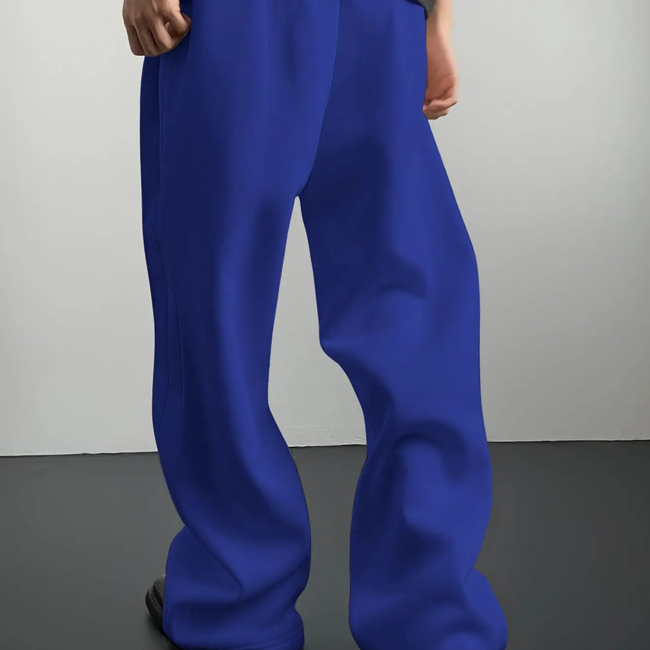 Pantalon de jogging pour homme, coupe droite, idéal pour le sport et la mode urbaine. Pantalon ample et décontracté avec cordon de serrage et plusieurs poches.