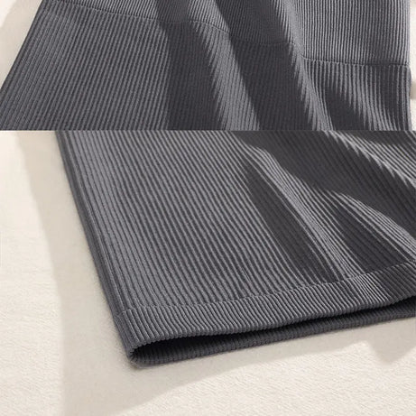FINETOO Printemps Été Nouvelle Jupe Mini Taille Haute Élastique Noire Affinante en Tricot Court pour Femmes Professionnelles