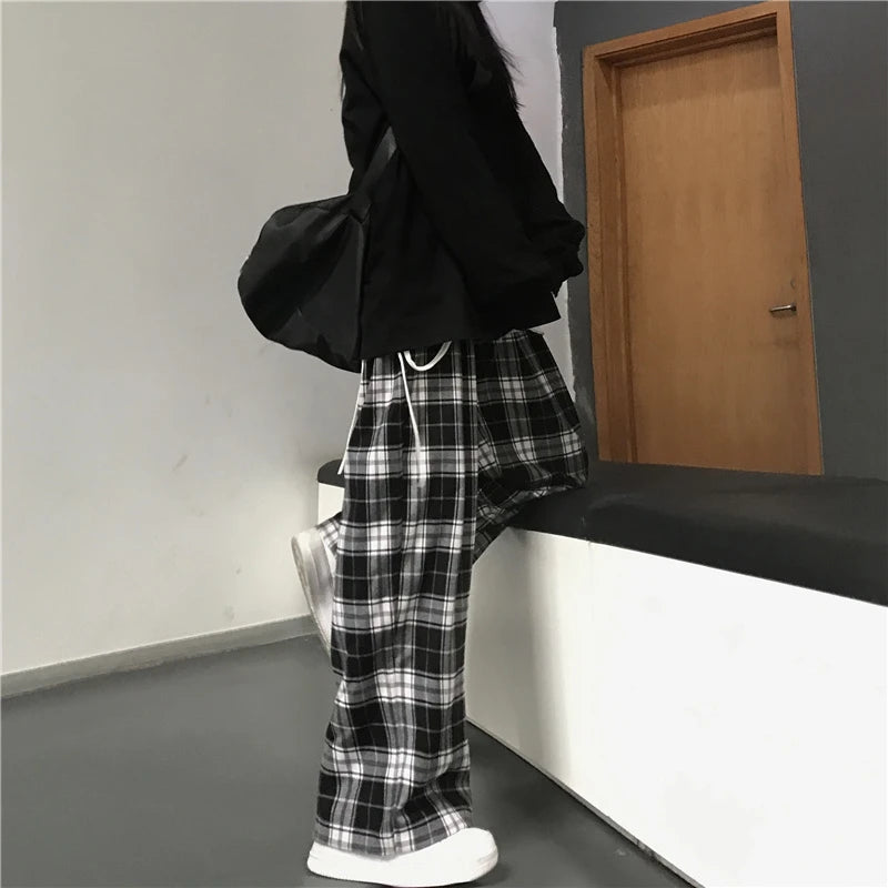 Pantalon de survêtement oversize pour femme, style tendance, à carreaux noirs, coupe ample, taille élastique, poches, style hip-hop unisexe, coupe ample.