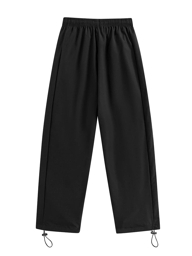 Pantalon de sport tendance pour homme, avec lignes, idéal pour la salle de sport et la course à pied. Poches latérales, séchage rapide et respirant.