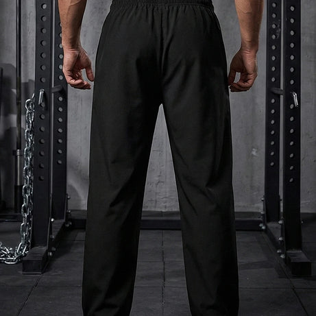 Pantalon de sport tendance pour homme, avec lignes, idéal pour la salle de sport et la course à pied. Poches latérales, séchage rapide et respirant.