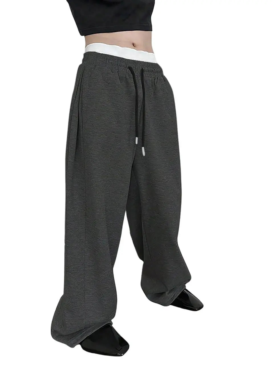 Pantalon de jogging pour homme, coupe droite, idéal pour le sport et la mode urbaine. Pantalon ample et décontracté avec cordon de serrage et plusieurs poches.