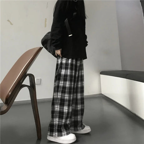 Pantalon de survêtement oversize pour femme, style tendance, à carreaux noirs, coupe ample, taille élastique, poches, style hip-hop unisexe, coupe ample.
