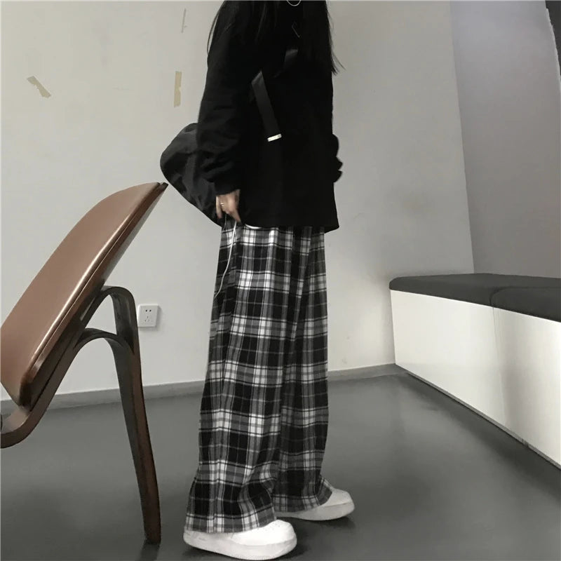Pantalon de survêtement oversize pour femme, style tendance, à carreaux noirs, coupe ample, taille élastique, poches, style hip-hop unisexe, coupe ample.