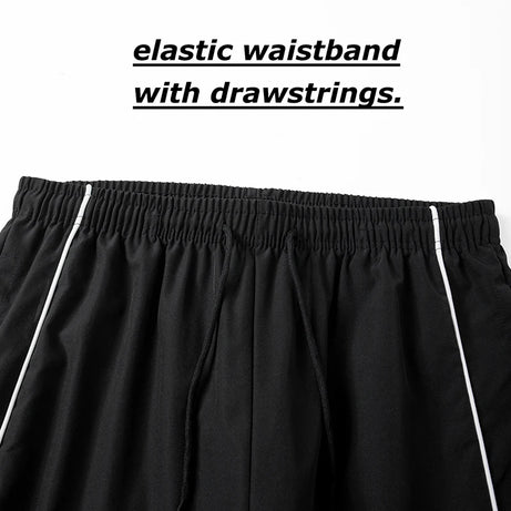 Pantalon de sport tendance pour homme, avec lignes, idéal pour la salle de sport et la course à pied. Poches latérales, séchage rapide et respirant.