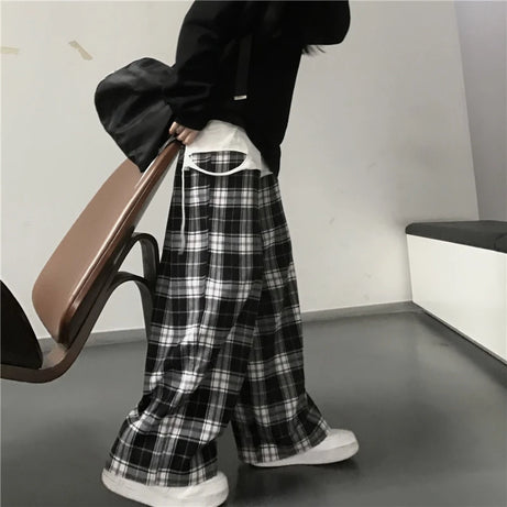 Pantalon de survêtement oversize pour femme, style tendance, à carreaux noirs, coupe ample, taille élastique, poches, style hip-hop unisexe, coupe ample.
