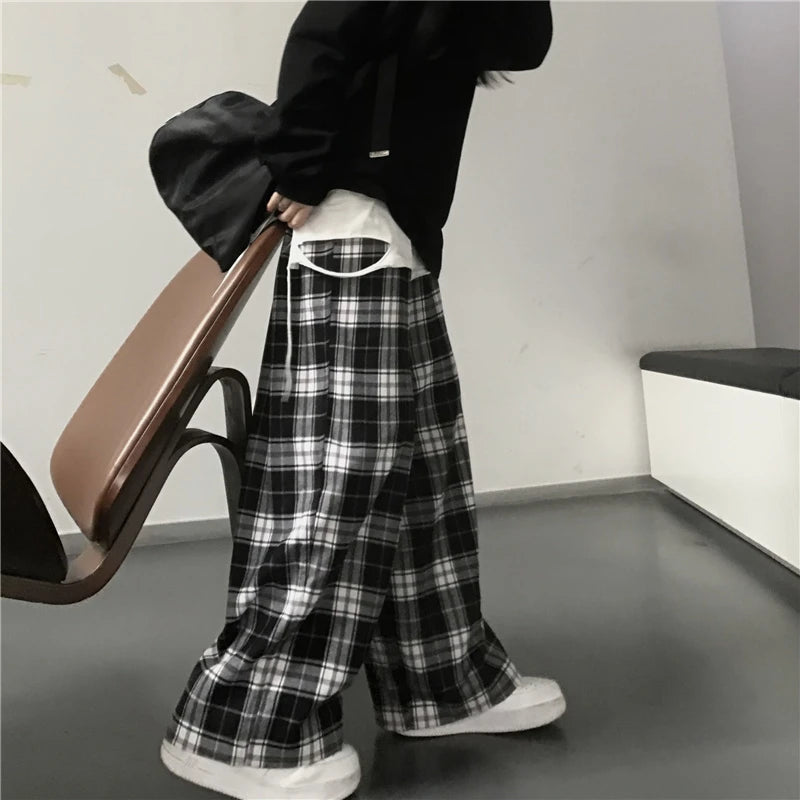 Pantalon de survêtement oversize pour femme, style tendance, à carreaux noirs, coupe ample, taille élastique, poches, style hip-hop unisexe, coupe ample.
