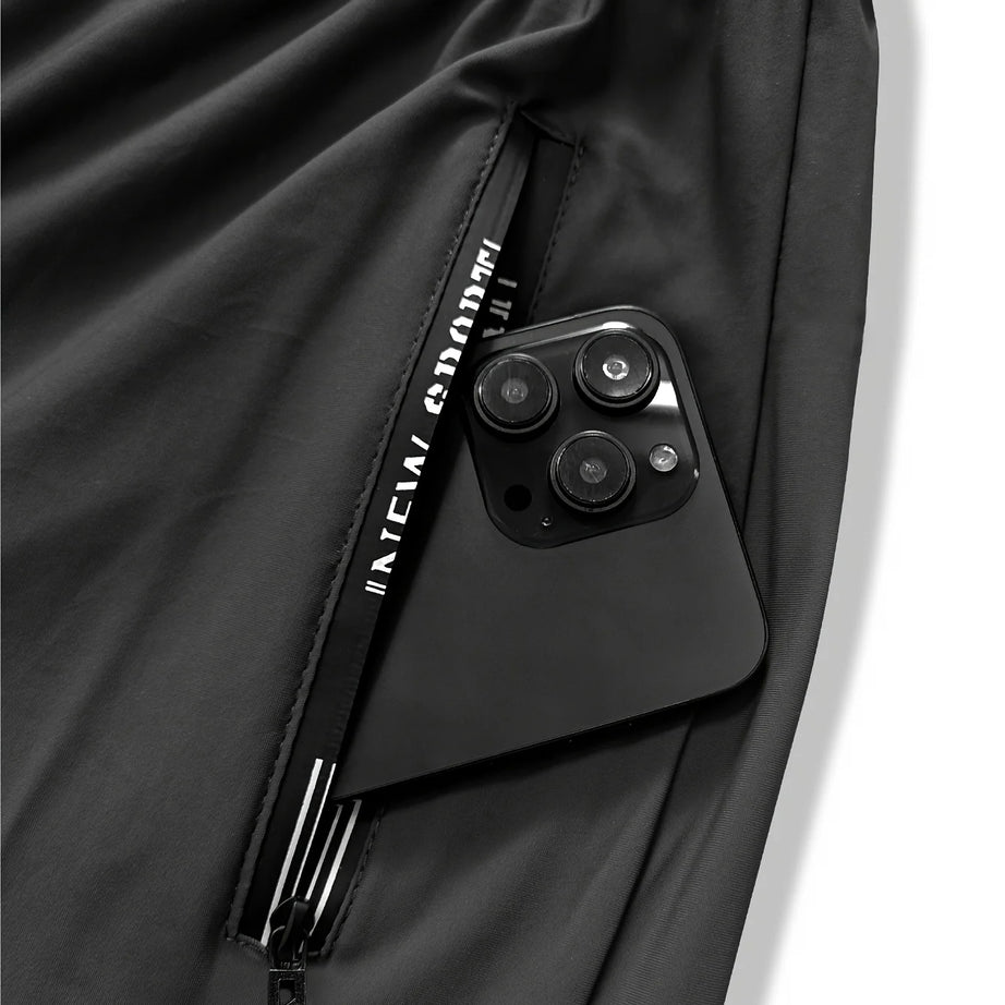 Pantalon de jogging homme, idéal pour la pêche. Modèle en soie glacée extensible avec poches zippées. Pantalon de sport respirant et élastique. Idée cadeau pour homme.